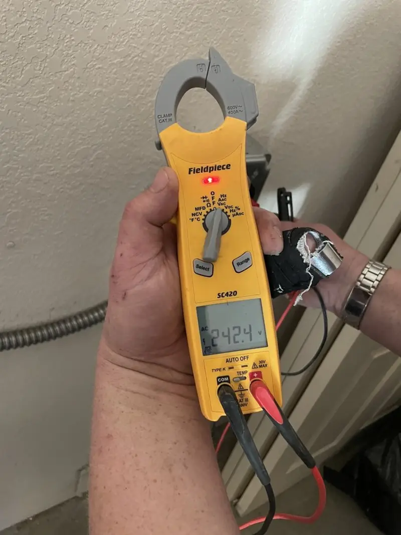 Voltage testing with clamp meter during Electrical Installation Services in Boyne City